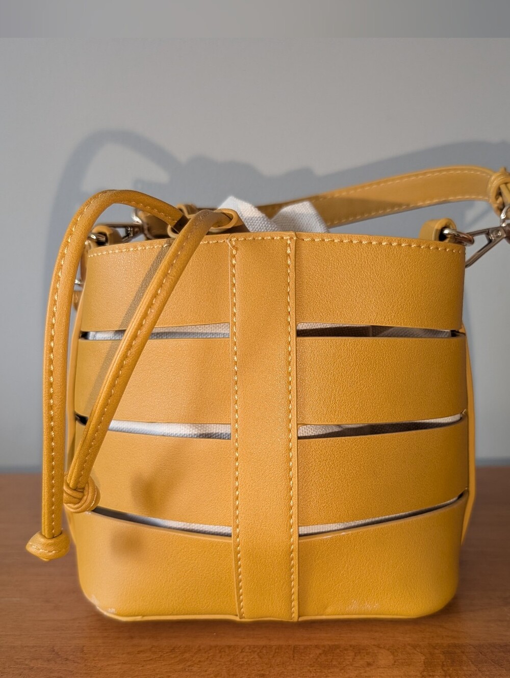 Madison West Yellow Cutout Bucket Crossbody